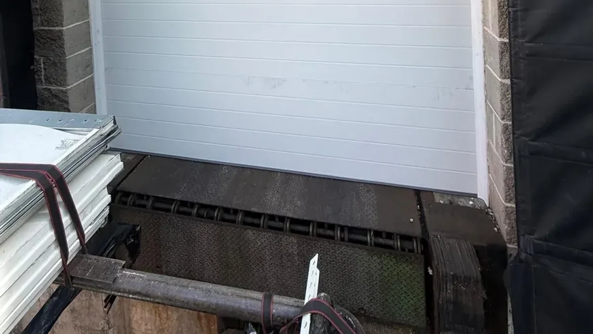 Commercial loading dock with a white overhead door