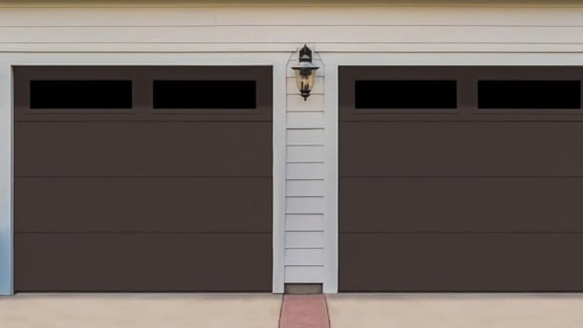 Pair of dark sectional garage doors with horizontal windows
